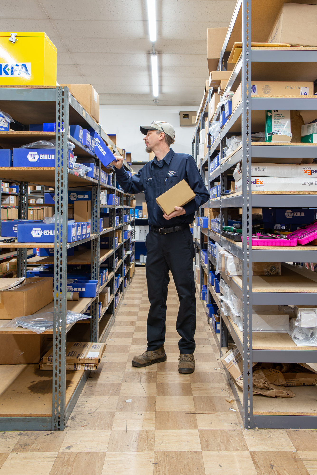 Crosspoint Power and Refrigeration employee pulling parts in part department