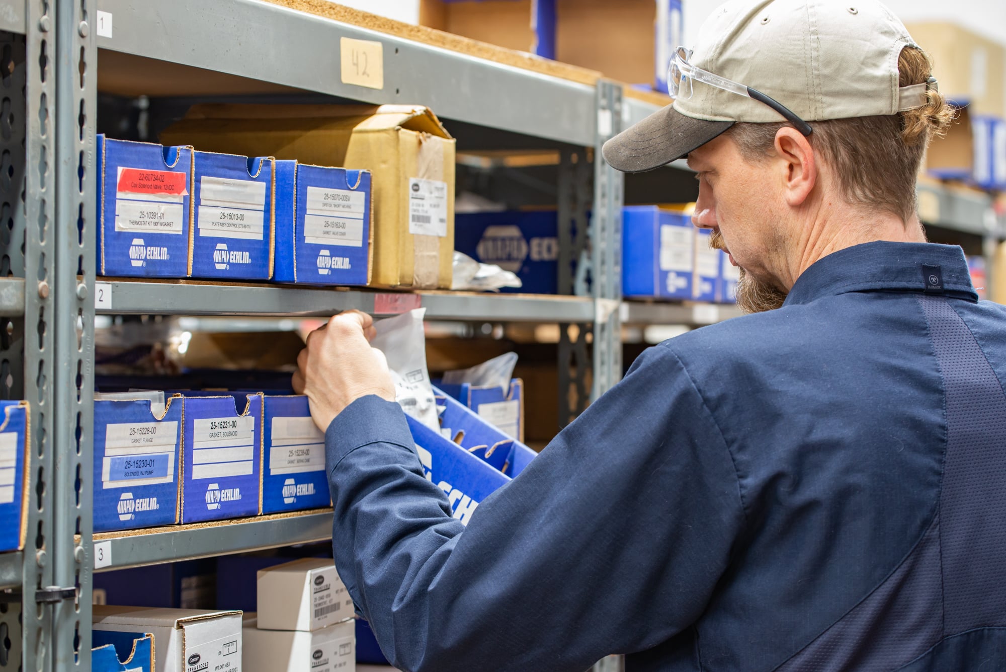 Crosspoint Power and Refrigeration employee pulling parts in part department