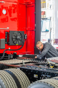 a condenser mounted on the rear of the truck cab