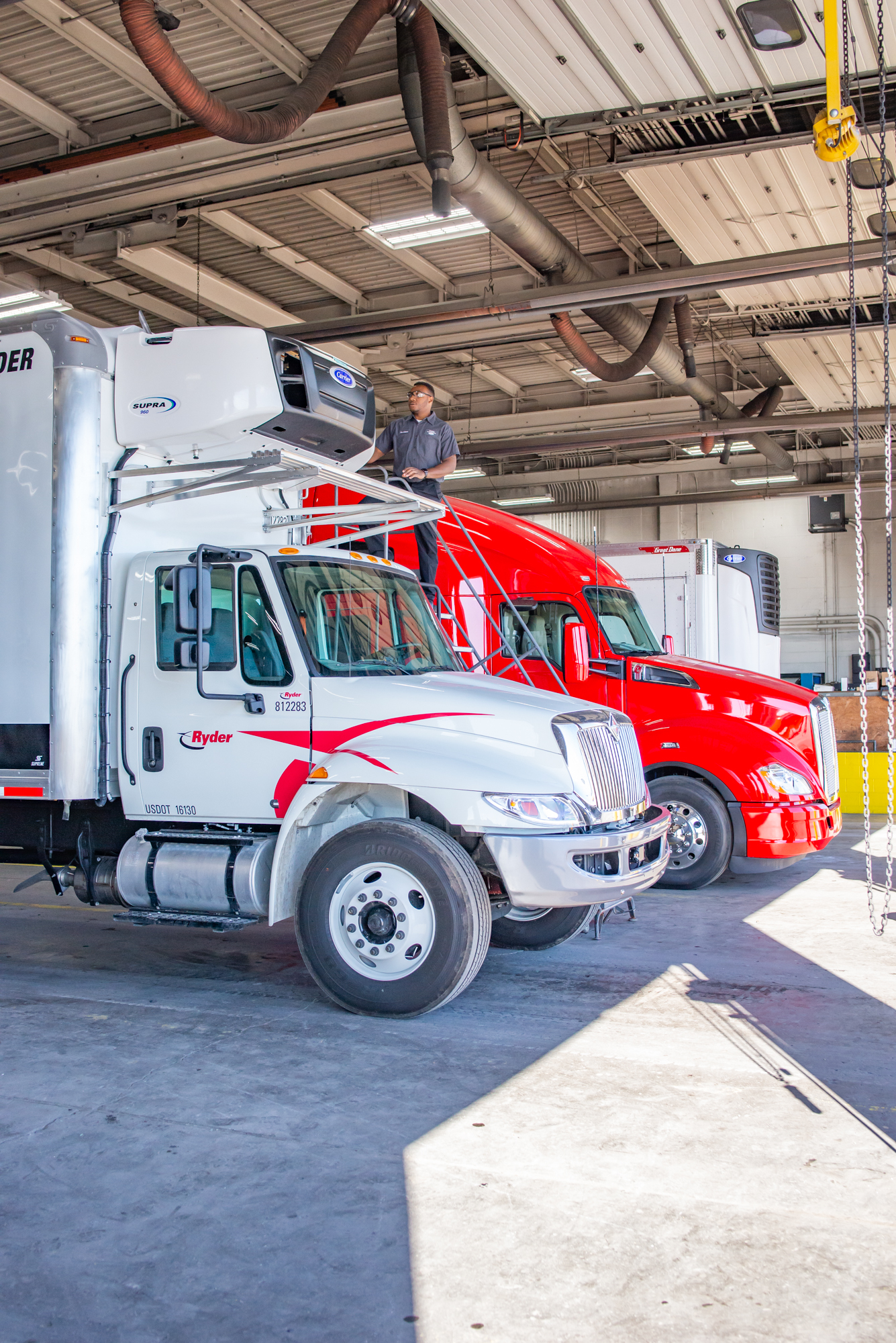 Crosspoint Power and Refrigeration Technician Working on a Carrier Truck Refrigeration Unit