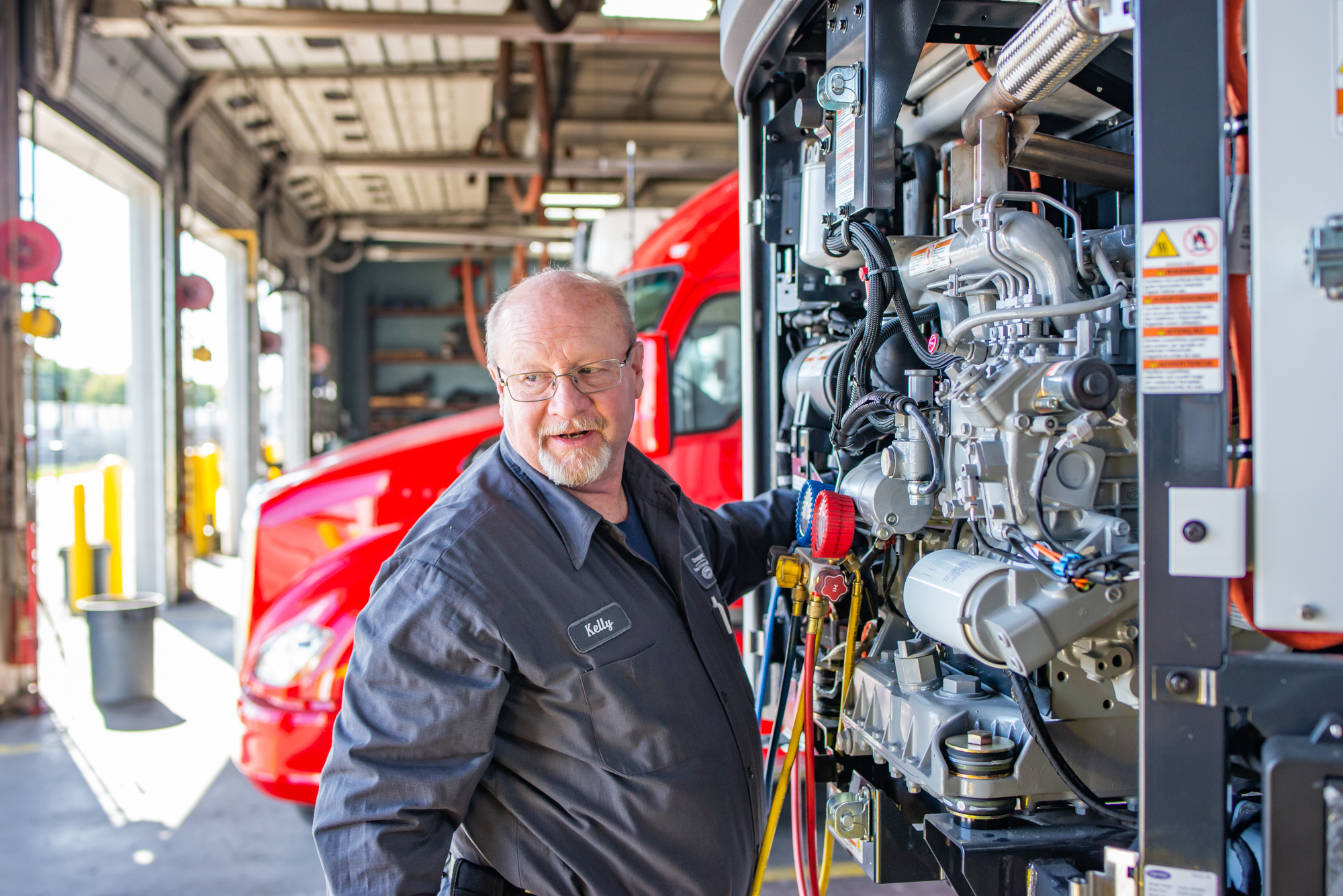 Crosspoint Power and Refrigeration Technician working on a Carrier Trailer Refrigeration Unit