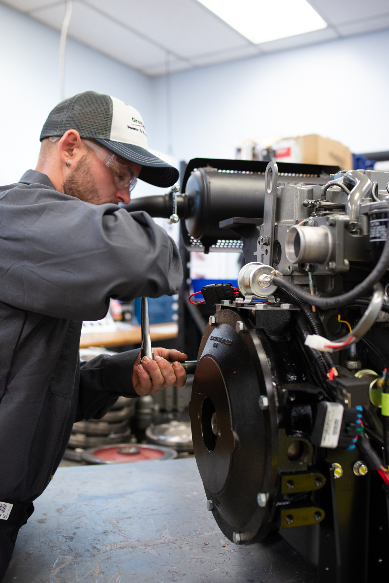 Engineer from Crosspoint Power and Refridgeration working on a Yanmar Engine