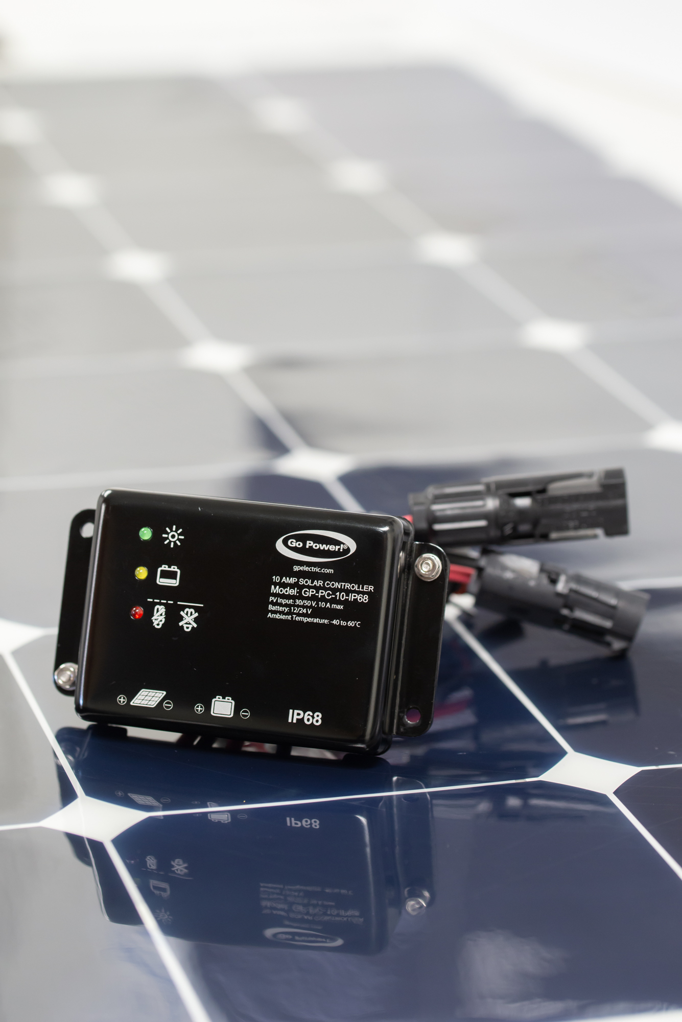 A Go Power Solar controller sitting on a solar panel